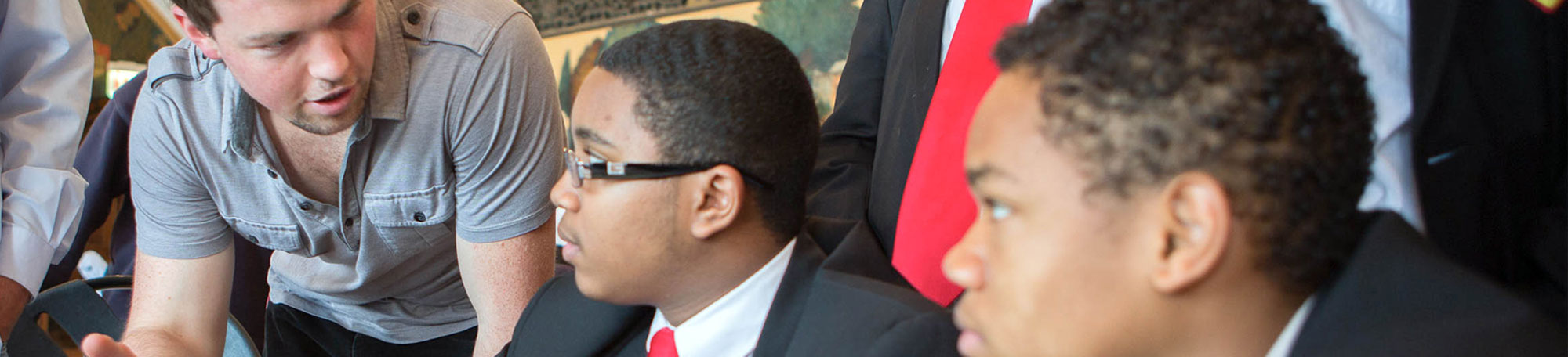 Ted Gonder (left) speaks with students from Gary Comer College Prep.