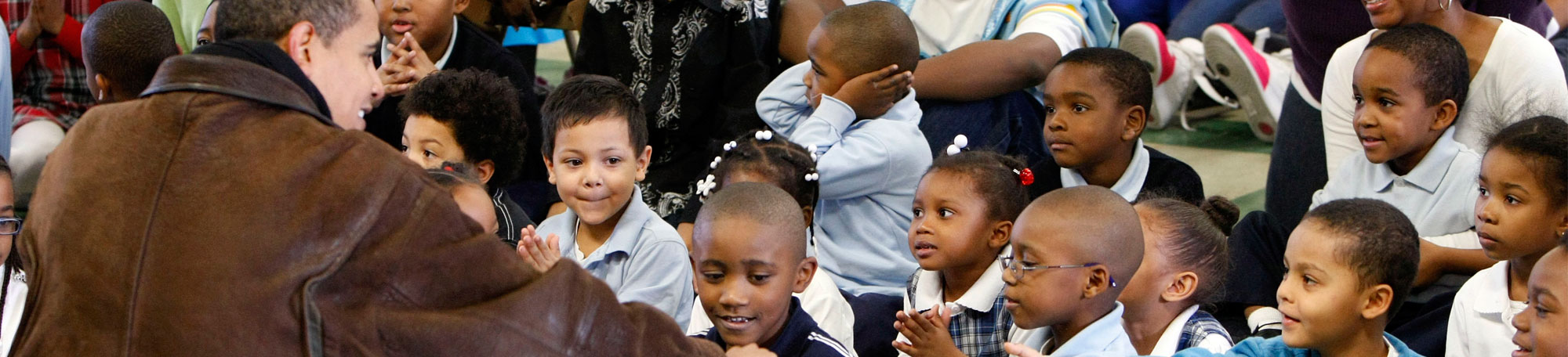 President Obama engages with young local children