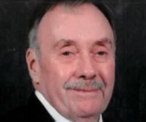 John W. Rippon smiles in a close-up.