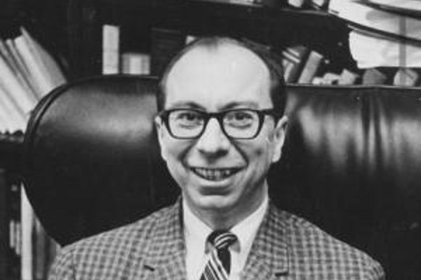 Morton A. Kaplan sits in a plush leather chair and smiles.