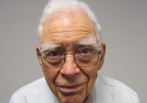 Richard “Dick” Miller smiles at the camera in a close-up.