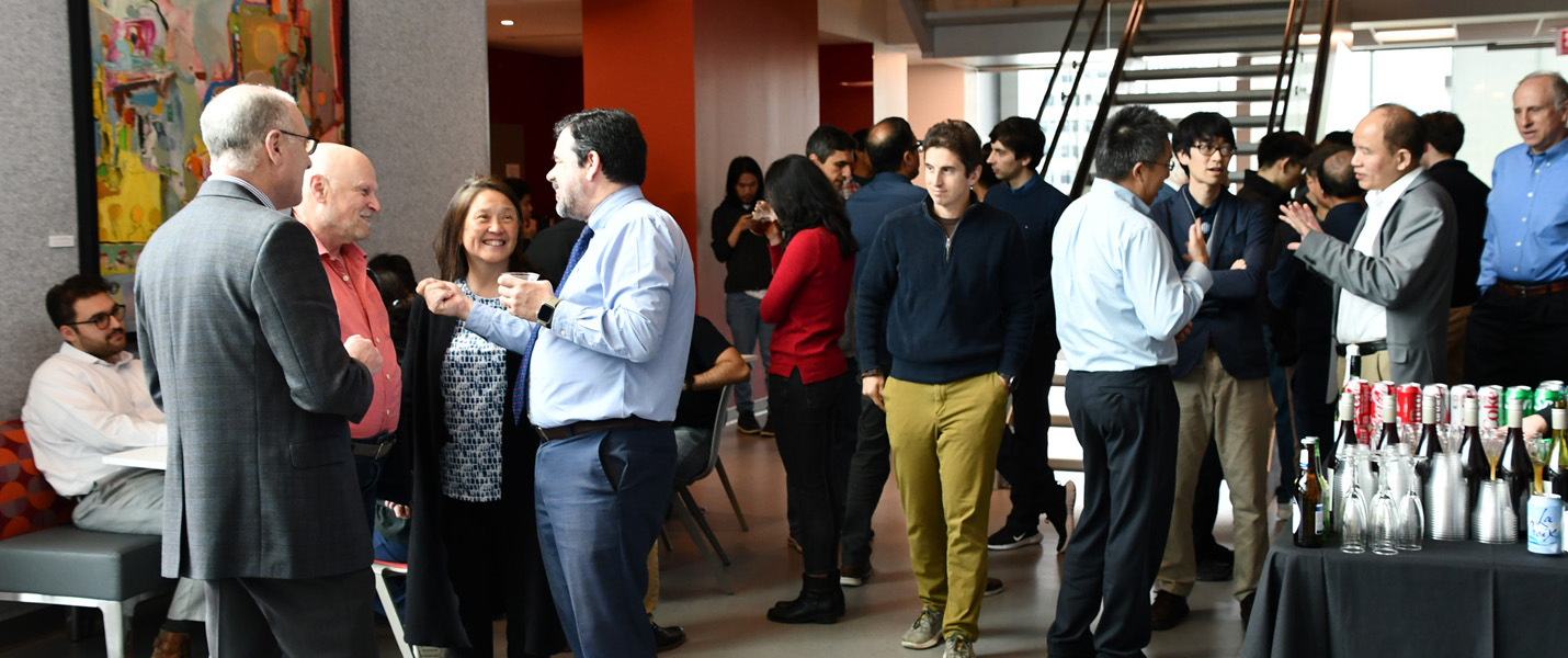 Photo of a group of people at the Leinweber Institute launch event