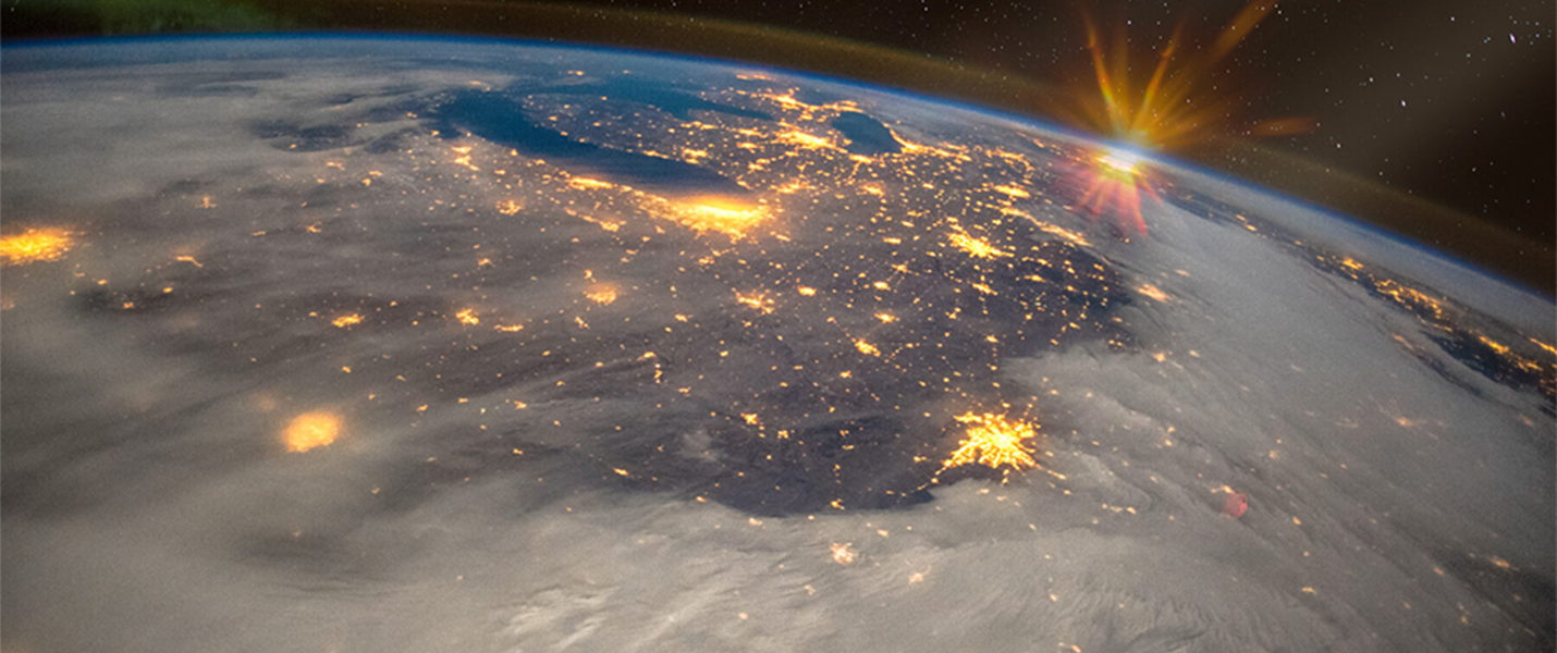 view of Earth from space lit up at night