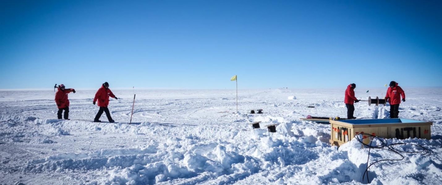 Scientists at work installing cables and electronic components for the Askaryan Radio Array