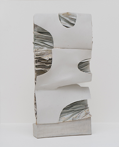 A standing white porcelain sculpture