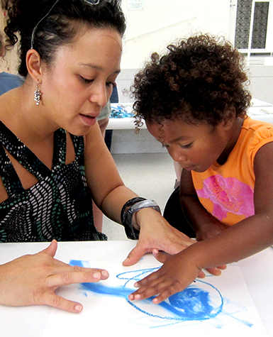 Family painting together at the Smart Museum. Photo by Erik L. Peterson.