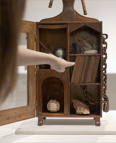 A wooden cabinet sculpture