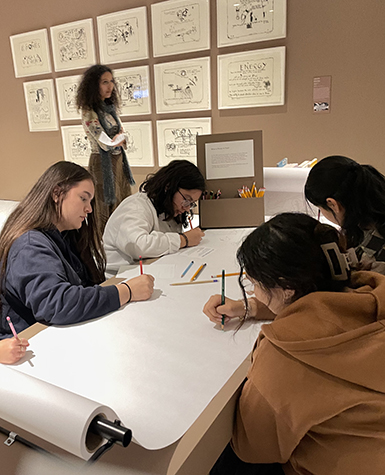 Students writing poems in a museum exhibition