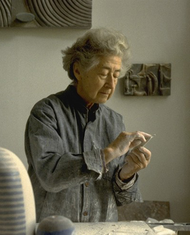 Ruth Duckworth sanding an artwork